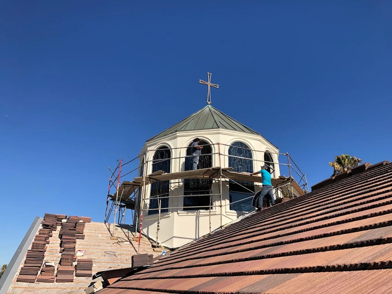 Church exterior showing stained glass preservation access near the tower